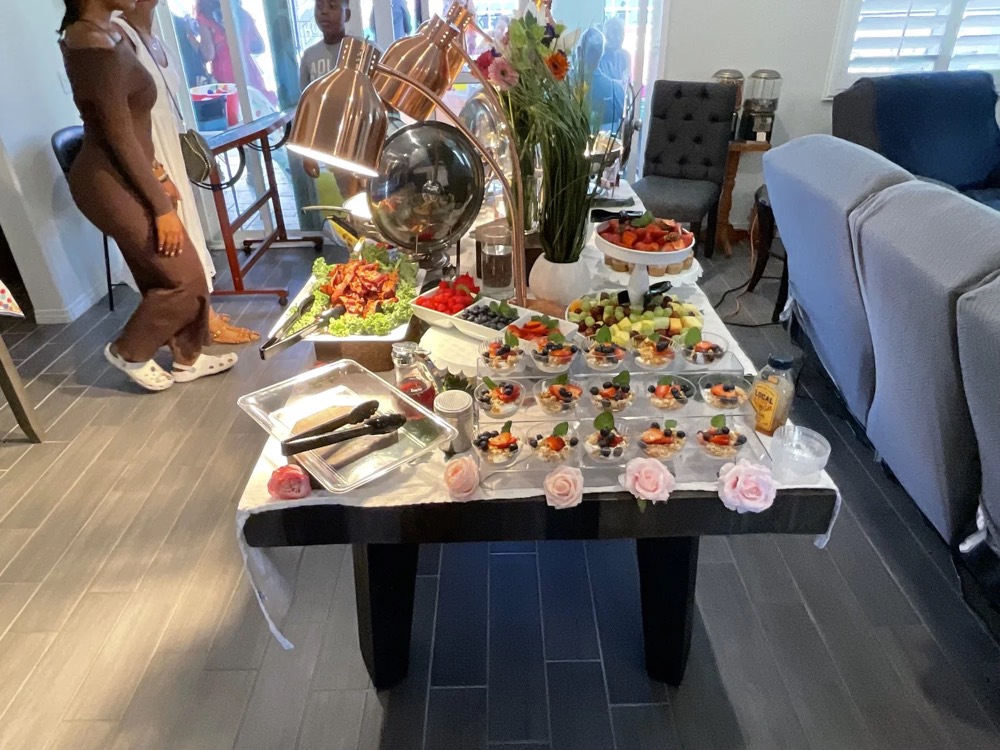 Styled brunch setup with berry parfaits and a fresh fruit display
