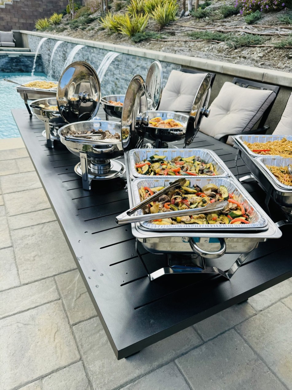 Poolside event catering buffet served from chafing dishes