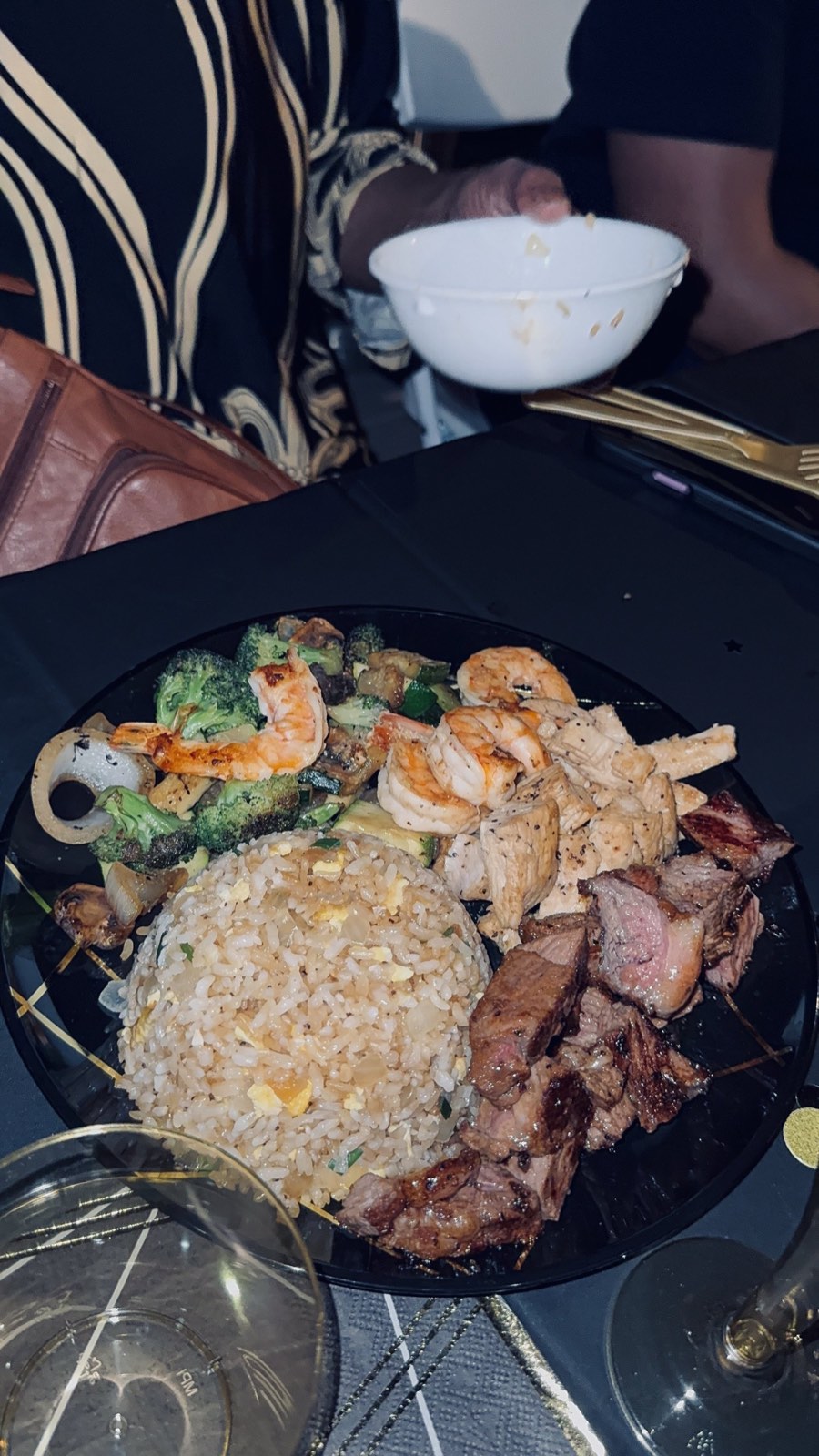 Hibachi plate of fried rice, grilled shrimp, chicken, steak and vegetables